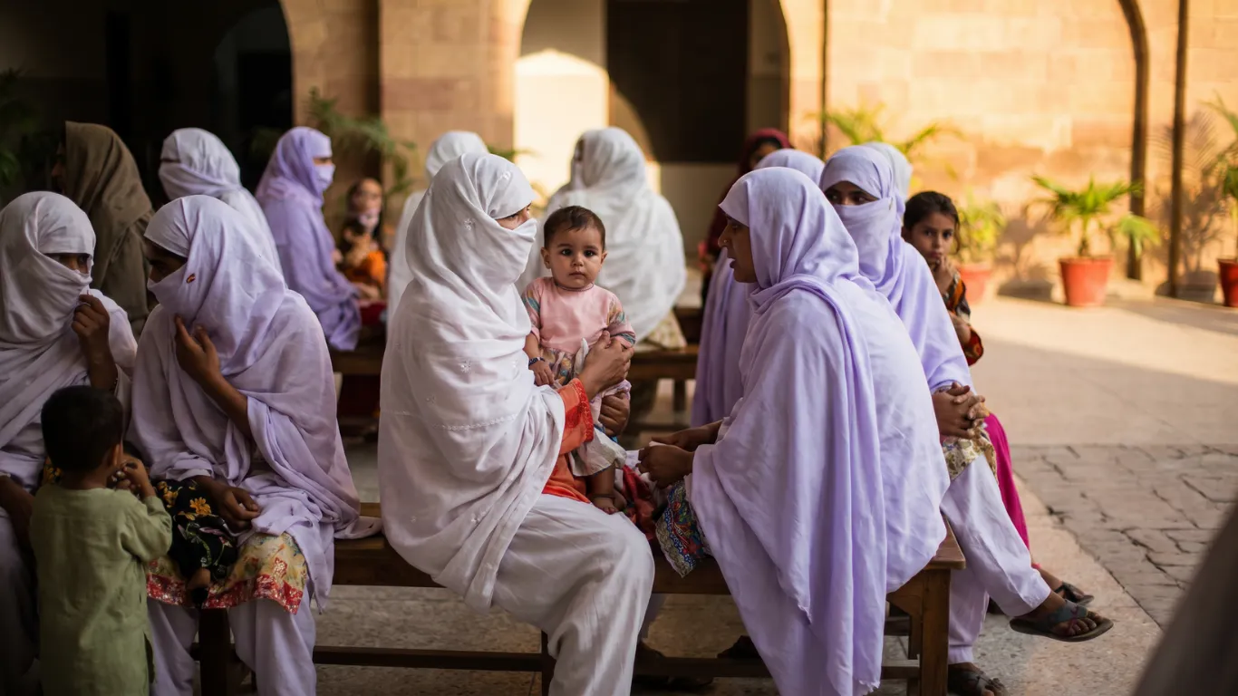 Pakistani mother and child at rural health clinic, Pakistan child health crisis 2026