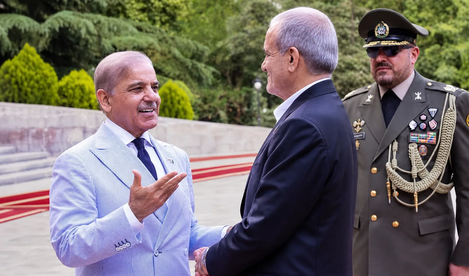 Iranian President Masoud Pezeshkian received by President Zardari and PM Shehbaz at Islamabad military base June 23 2026